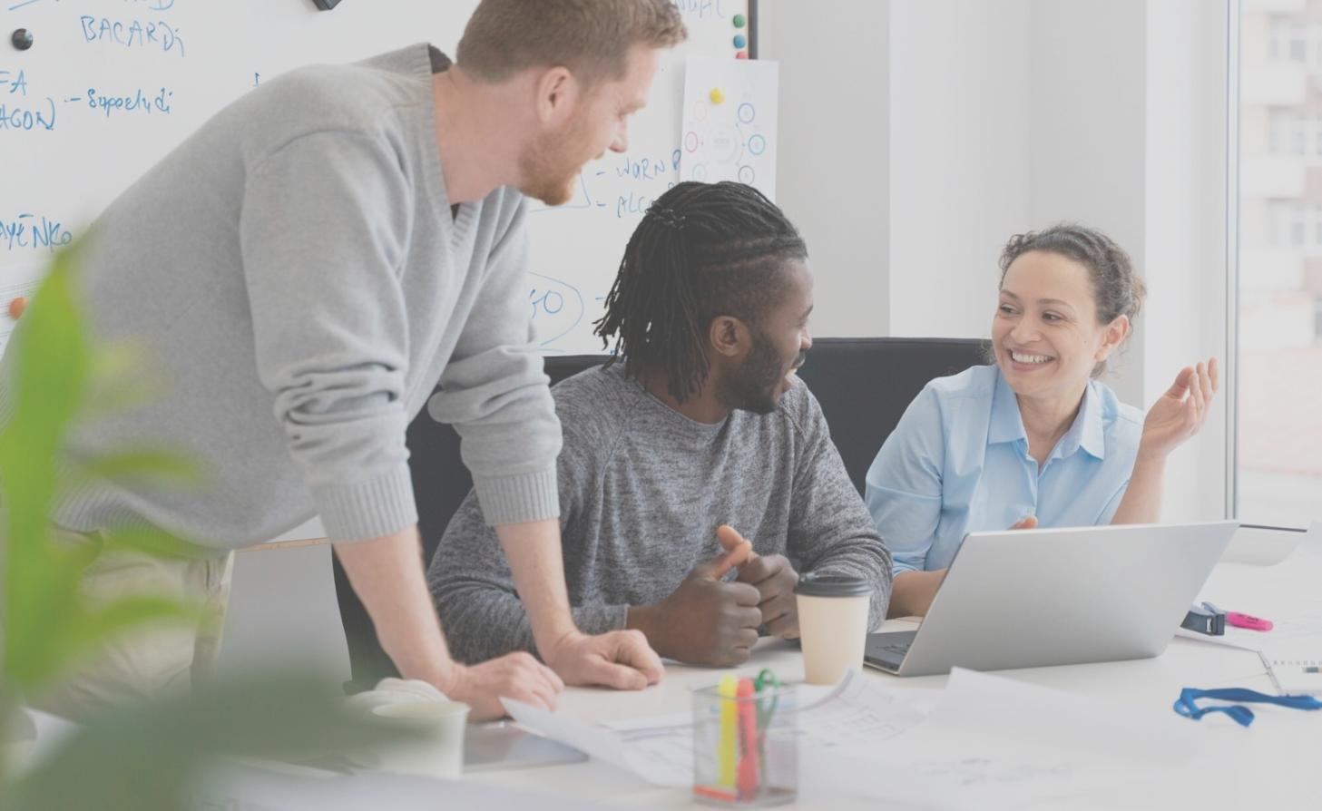 Business advisory team reviewing acquisition documents